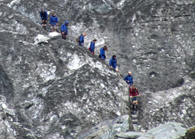 Close up-Group coming down glacier steps