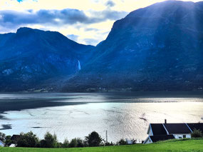 Feigefossn falls across fjord by Hoyheimsvik