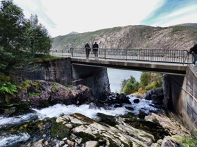 Bridge over Langfossen flowing to fjord