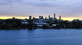 Sun setting over Brisbane leaving port