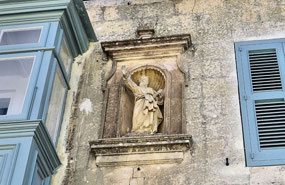 Religious Statue on Building