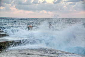 kids jumping into the wave & landing on dock