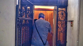 Opening the elevator's iron doors