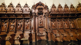 Wooden seats for bishops behind the Alter