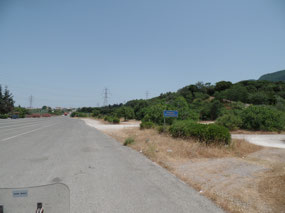 Where the road is was the beach.mountain on right