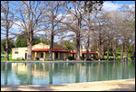 Historic building by the pool in San Pedro Park.