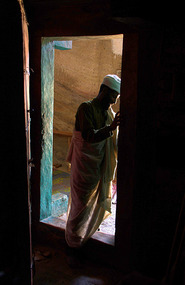 Priest entering the church