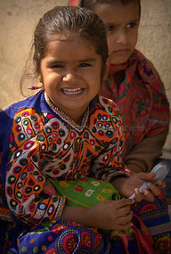 Ribari school child wearing trad mirror embroidery