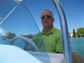Skip at the helm on Lac d'Anncey