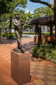 Naked trumpeter statue 