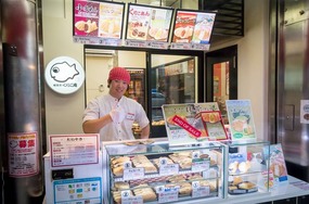 Cool guy selling fish shaped ham and cheese 