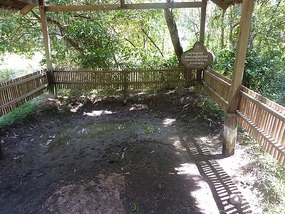 One of the pits where the bodies were found