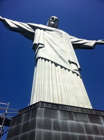At the base of the statue