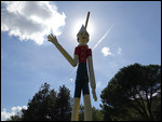 Pinocchio pointing the way at Collodi