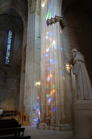 Stained glass light inside Batalha