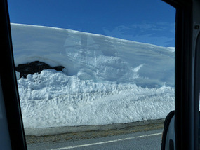 Snow cut back from road
