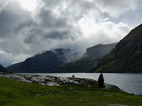 View up fjord in rain