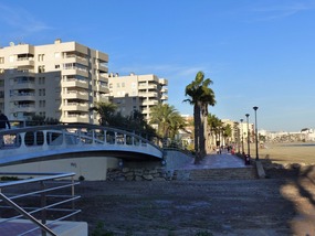 Bridge over dry river to prom