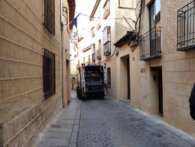 Squeeze against the wall to let dustcart pass
