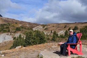 Trevor trying out the red adirondack chair