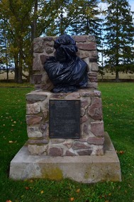 Bust of Henry Wadsworth wrapped for winter