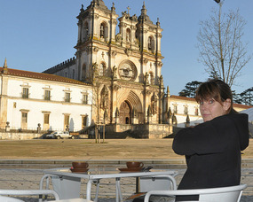 Hugging Herself Outside Monastery