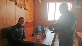 Cosmin offering Aaron wine upon arrival...