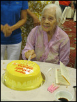 Ah Ma cutting the cake