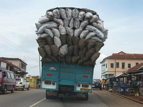 Greatly overloaded truck on the highway