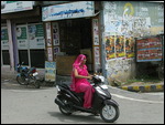 Pink sari motor cyclist