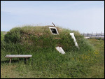 Some of the replica buildings covered in sod