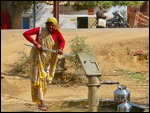 Woman at the water pump