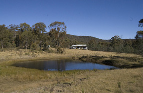 Dam with homestead in background