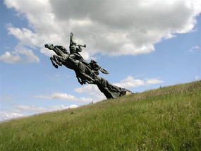 Horses leaping over road