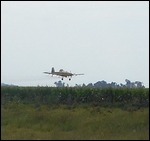 A Crop duster spraying the fields.